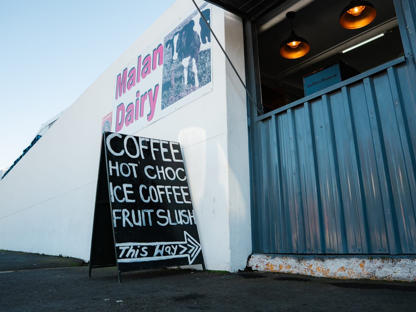 The Malan's factory shop storefront on Eiland Street, Paarl, with the coffee chalkboard out front