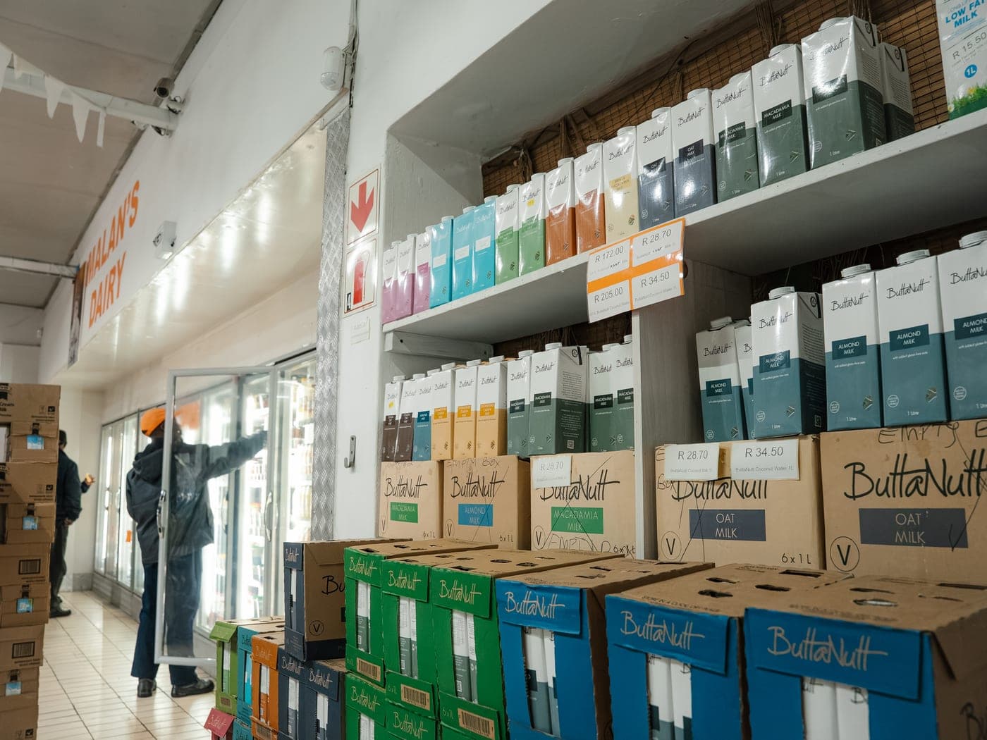 Shelves of plant-based milks and the wider range stocked at the Malan's factory shop