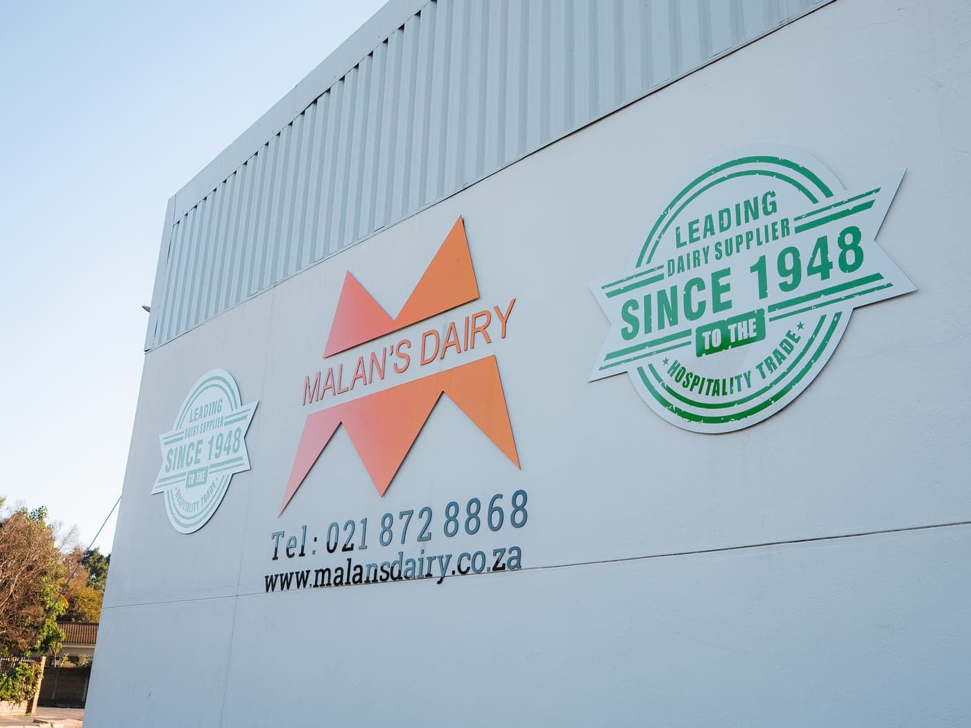 The Malan's Dairy 'Leading dairy supplier since 1948' branded wall