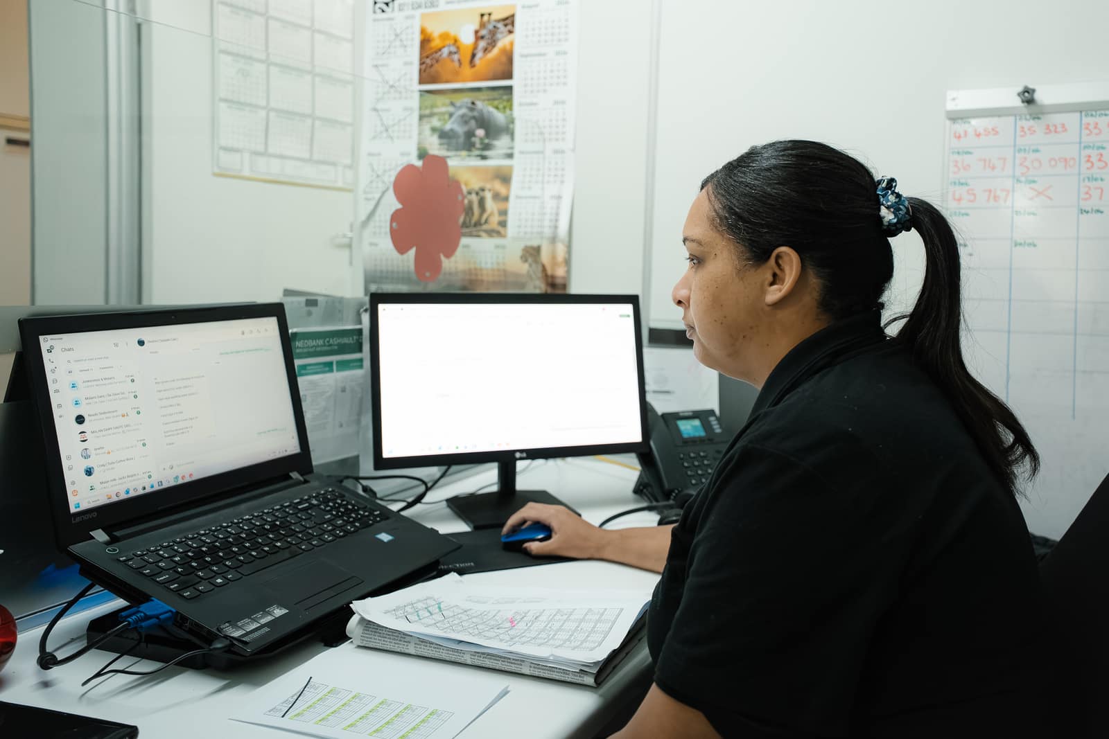 A Malan's Dairy office staff member working at her computer