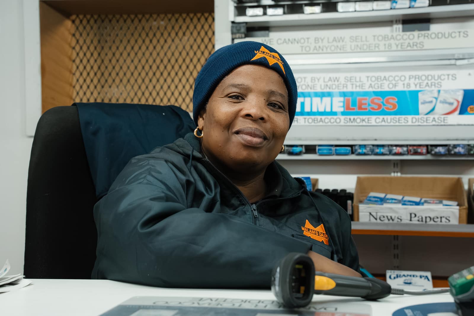 A Malan's Dairy Factory Shop team member at the till