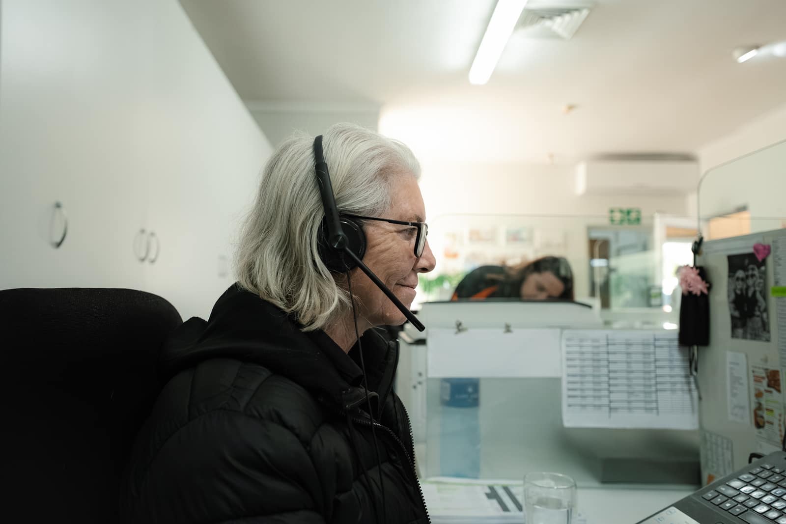 A Malan's Dairy telesales rep on a headset taking a customer order