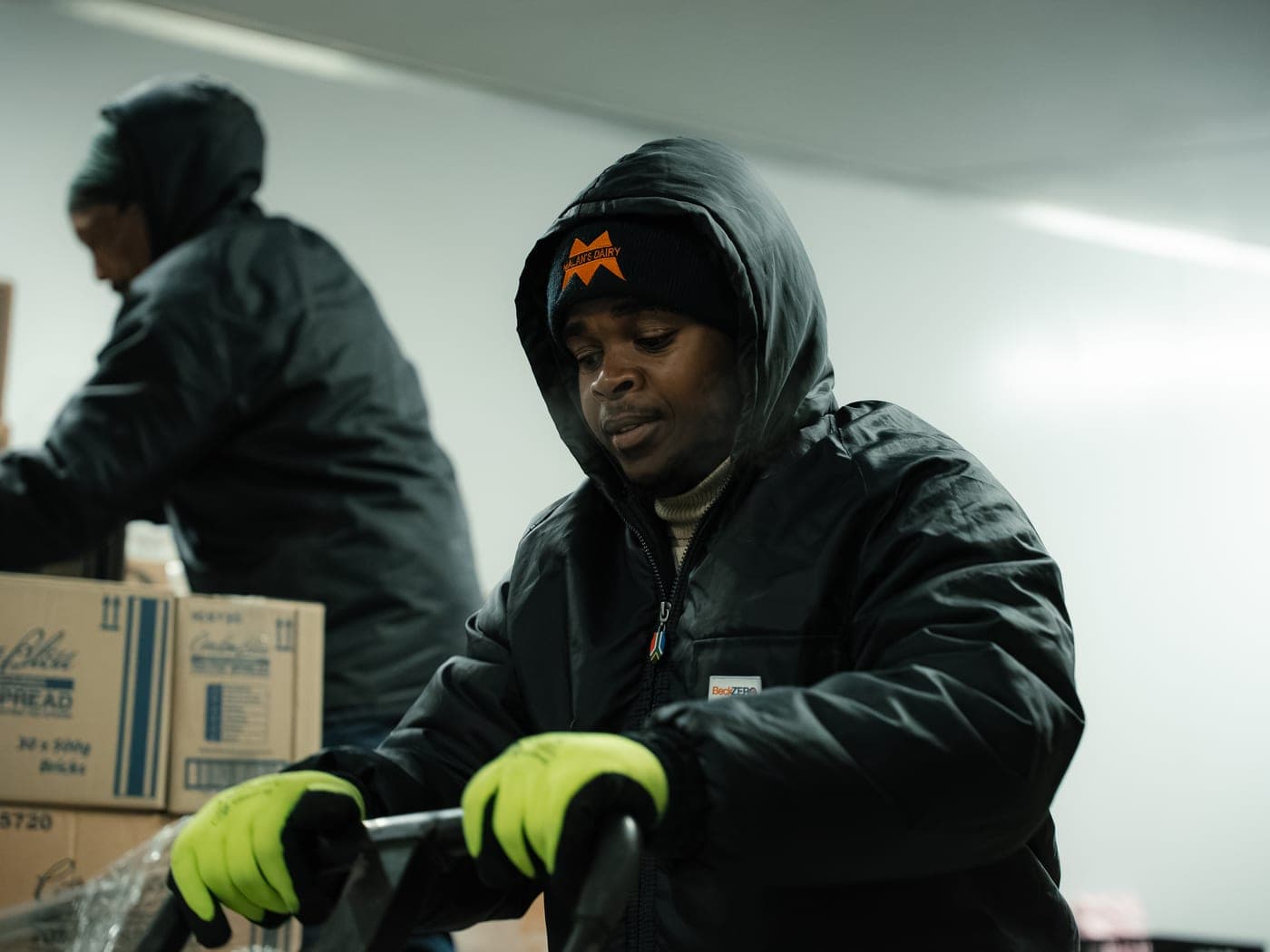 Malan's Dairy warehouse staff working in the cold room